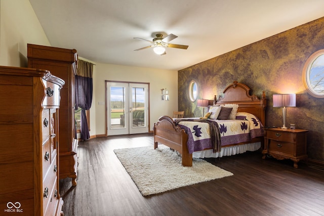 bedroom with dark wood finished floors, access to exterior, a ceiling fan, an accent wall, and baseboards