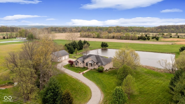 birds eye view of property featuring a rural view and a water view