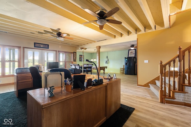 office space with beamed ceiling, baseboards, light wood-style floors, and ceiling fan