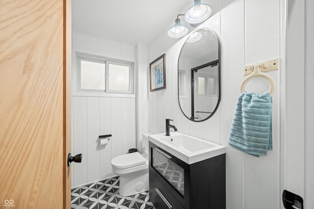 bathroom with vanity and toilet