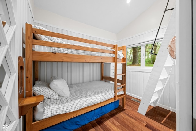 bedroom featuring vaulted ceiling and wood finished floors