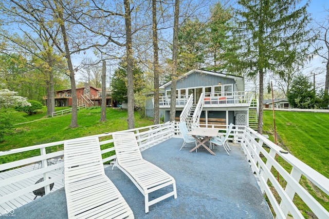 view of patio / terrace with a deck, stairs, and outdoor dining space