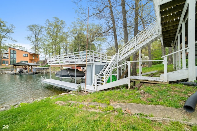 view of dock with boat lift, stairs, and a water view
