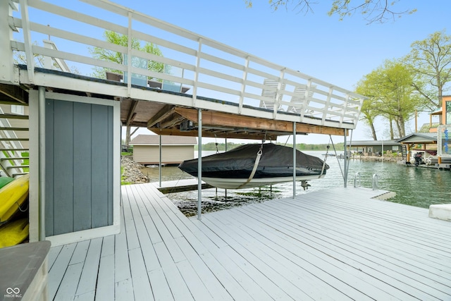 view of dock featuring a water view and boat lift