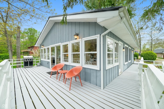 wooden deck featuring area for grilling