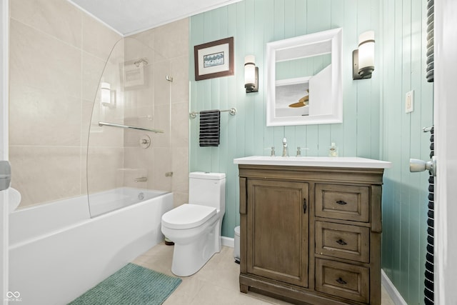 bathroom featuring vanity, tile patterned flooring, washtub / shower combination, and toilet