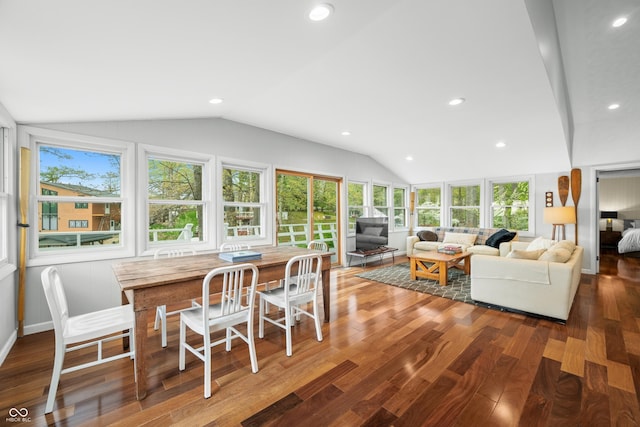 living area featuring recessed lighting, vaulted ceiling, and wood finished floors