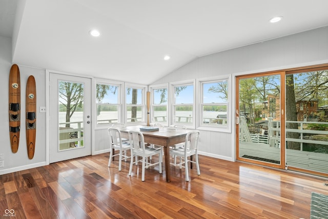 sunroom with vaulted ceiling, recessed lighting, and wood finished floors