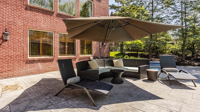 view of patio / terrace featuring fence and an outdoor living space
