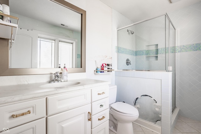 full bath with a stall shower, vanity, toilet, tile patterned flooring, and visible vents