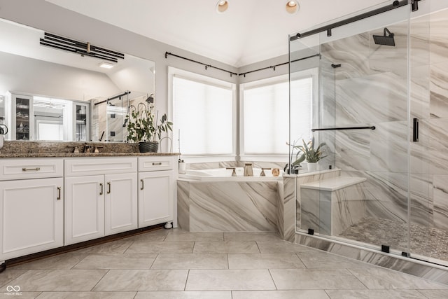 bathroom featuring recessed lighting, lofted ceiling, vanity, a marble finish shower, and a bath