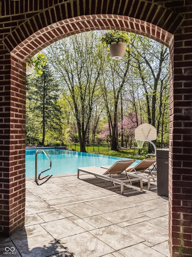pool featuring a patio area