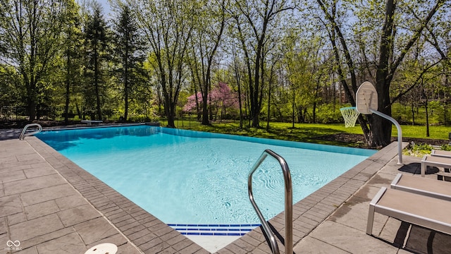 outdoor pool featuring a patio area
