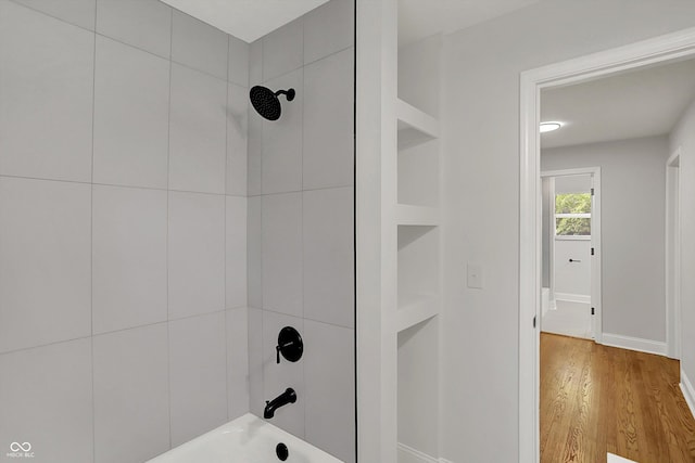 4775 E 56th St, Indianapolis, IN 46220 - full bathroom with baseboards, wood finished floors, and shower / bathtub combination