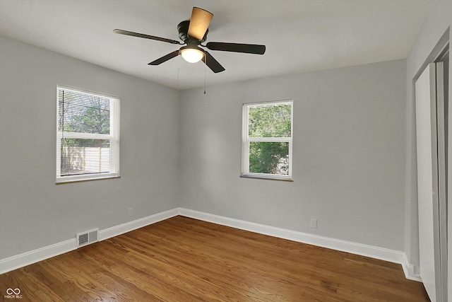 4775 E 56th St, Indianapolis, IN 46220 - interior space with wood finished floors, visible vents, baseboards, and multiple windows