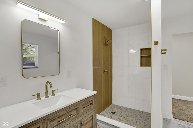 4775 E 56th St, Indianapolis, IN 46220 - full bath featuring baseboards, a tile shower, vanity, and marble finish floor
