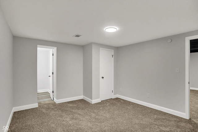 4775 E 56th St, Indianapolis, IN 46220 - interior space with carpet flooring, baseboards, and visible vents