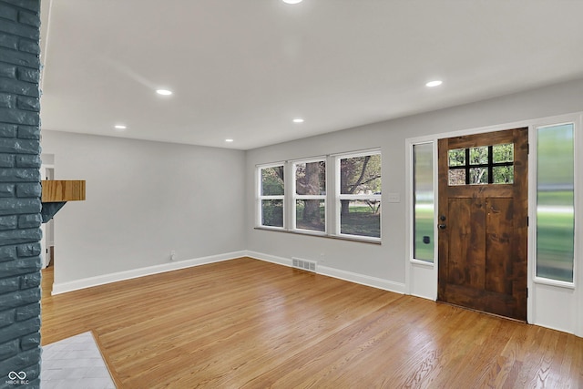 4775 E 56th St, Indianapolis, IN 46220 - entrance foyer featuring wood finished floors, visible vents, a healthy amount of sunlight, and recessed lighting