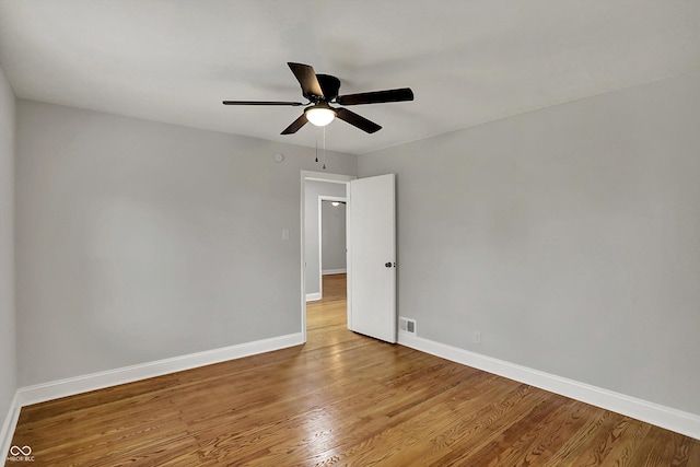 4775 E 56th St, Indianapolis, IN 46220 - empty room with visible vents, a ceiling fan, light wood-style flooring, and baseboards
