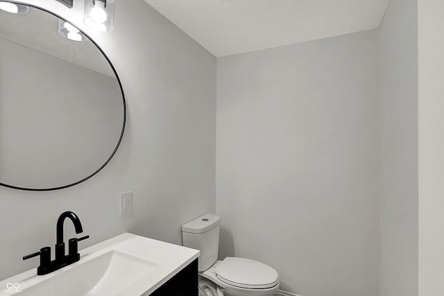 4775 E 56th St, Indianapolis, IN 46220 - half bath featuring vanity, toilet, and baseboards