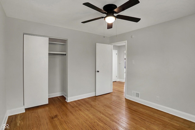 4775 E 56th St, Indianapolis, IN 46220 - unfurnished bedroom with visible vents, baseboards, a closet, light wood finished floors, and a ceiling fan