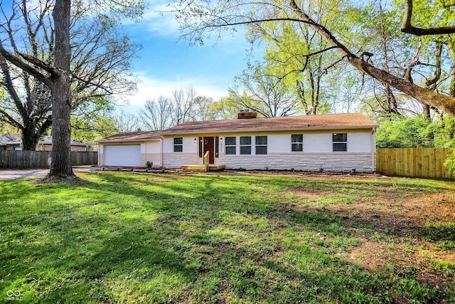 4775 E 56th St, Indianapolis, IN 46220 - ranch-style home featuring a chimney, fence, a garage, stone siding, and a front lawn