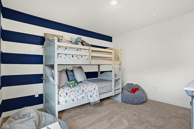 carpeted bedroom featuring baseboards