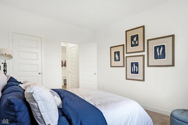 carpeted bedroom featuring baseboards