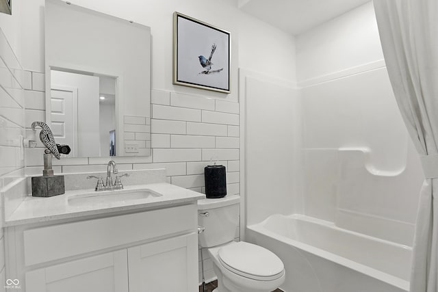 full bathroom featuring decorative backsplash, tile walls, shower / bathing tub combination, toilet, and vanity