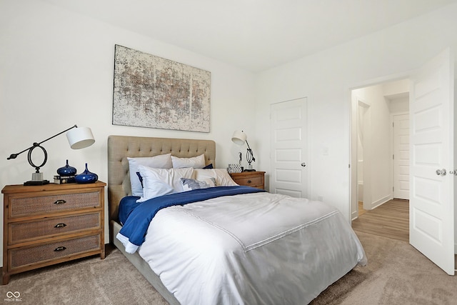 bedroom with light colored carpet