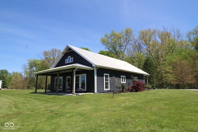 12472 E County Road 600 Rd S, Crothersville, IN 47229 - view of side of home featuring a lawn and a patio