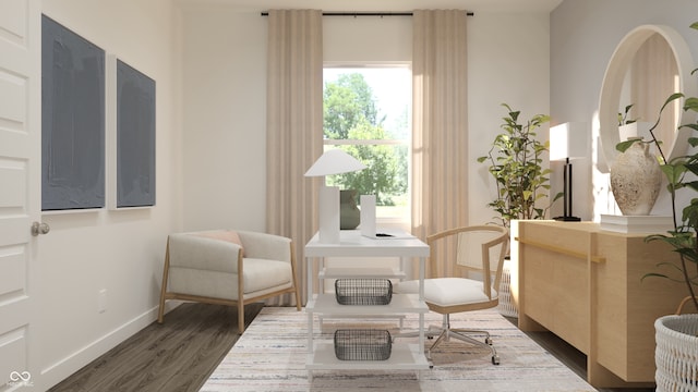 sitting room featuring dark wood-style flooring and baseboards