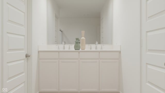 full bath with a sink and double vanity