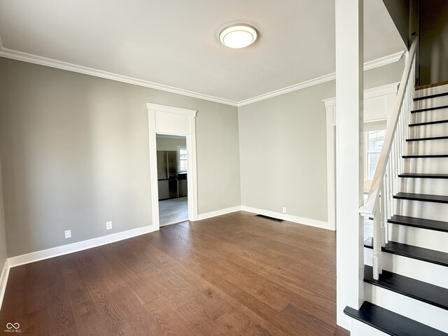 1378 Hannibal St, Noblesville, IN 46060 - spare room with ornamental molding, dark wood-style floors, visible vents, and baseboards