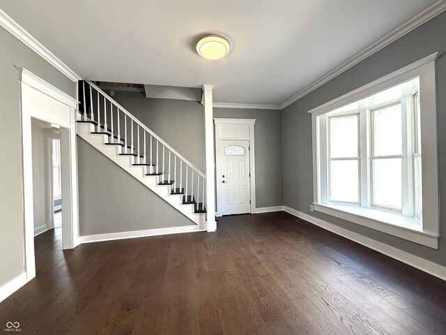 1378 Hannibal St, Noblesville, IN 46060 - foyer entrance with dark wood-style floors, decorative columns, baseboards, stairway, and ornamental molding