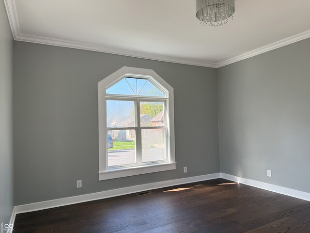 1378 Hannibal St, Noblesville, IN 46060 - spare room with visible vents, crown molding, dark wood-style floors, and baseboards