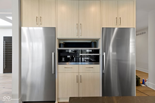 1333 Chatham Rdg Ct, Westfield, IN 46074 - kitchen with light brown cabinetry, visible vents, freestanding refrigerator, and stainless steel refrigerator