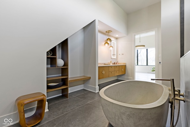 1333 Chatham Rdg Ct, Westfield, IN 46074 - bathroom with vanity, concrete floors, and a freestanding bath