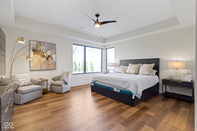 1333 Chatham Rdg Ct, Westfield, IN 46074 - bedroom with baseboards, a tray ceiling, and hardwood / wood-style floors
