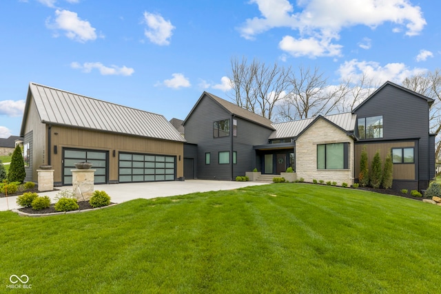 1333 Chatham Rdg Ct, Westfield, IN 46074 - view of front of house featuring a standing seam roof, metal roof, driveway, a front yard, and an attached garage