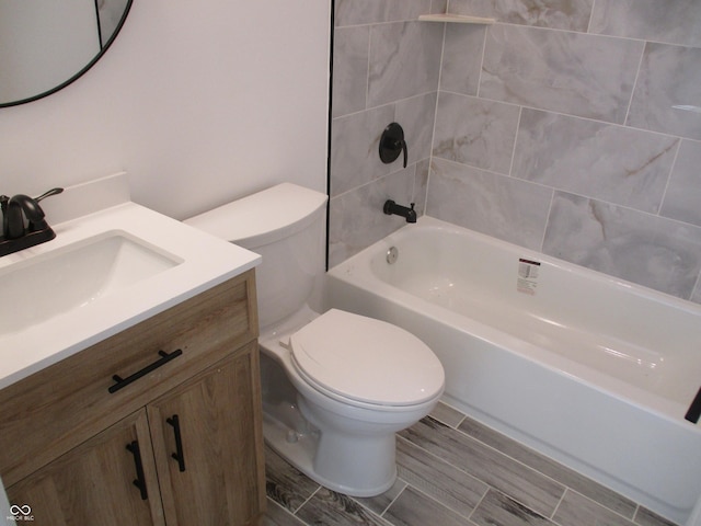 full bath featuring toilet, washtub / shower combination, and vanity