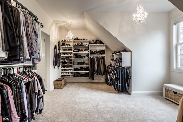 spacious closet featuring carpet floors and a notable chandelier