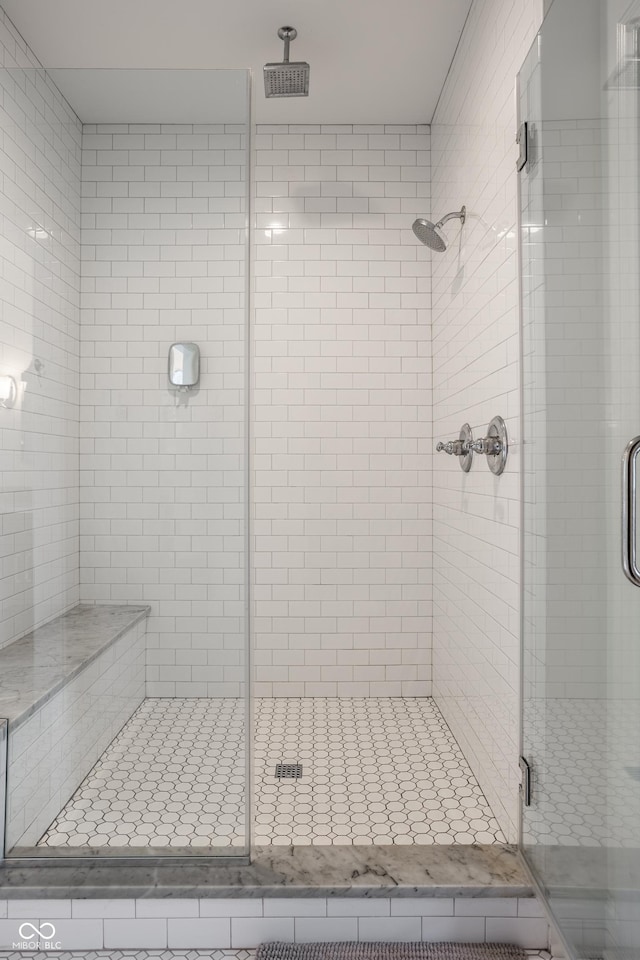 full bath featuring a shower stall