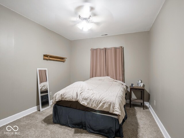 bedroom with carpet floors and baseboards