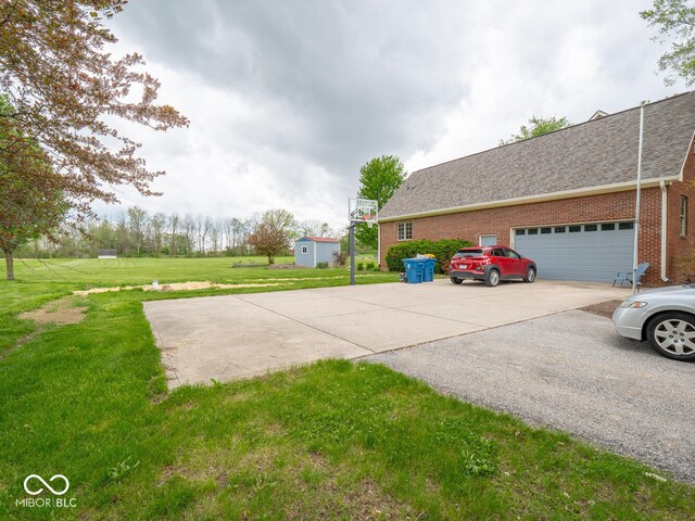 view of home's exterior with brick siding, a yard, concrete driveway, and a shingled roof