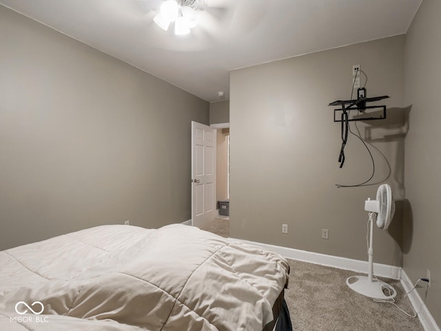 bedroom featuring carpet, baseboards, and a ceiling fan
