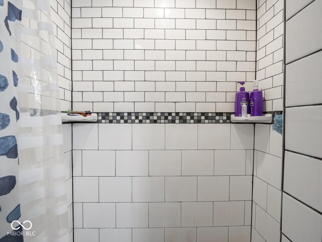 bathroom view of tiled shower