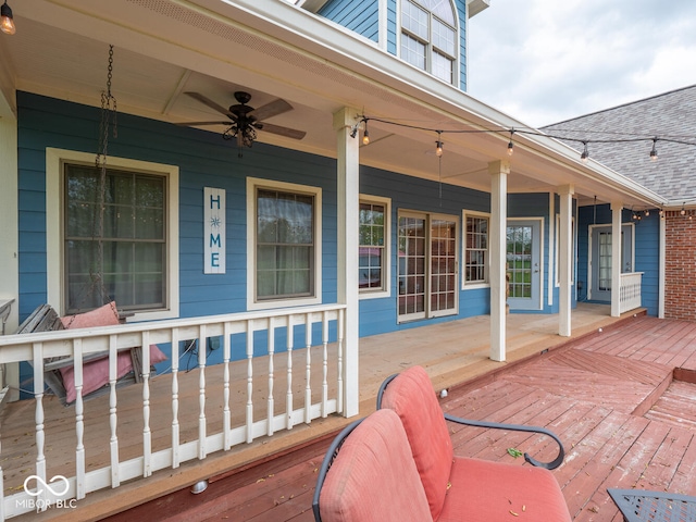 wooden deck featuring a porch and ceiling fan