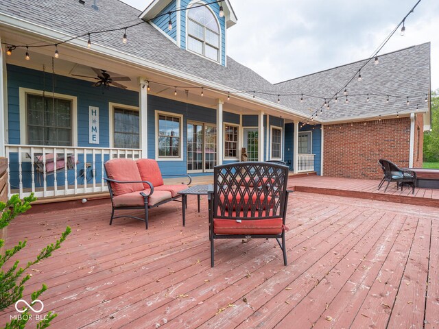 deck featuring an outdoor hangout area and a ceiling fan
