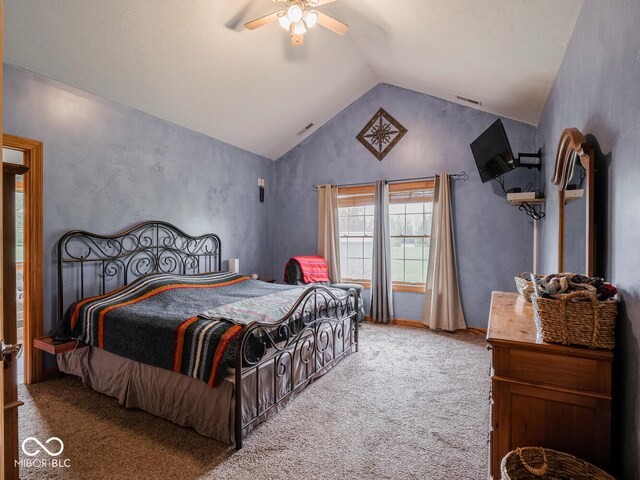 bedroom with carpet floors, lofted ceiling, and ceiling fan